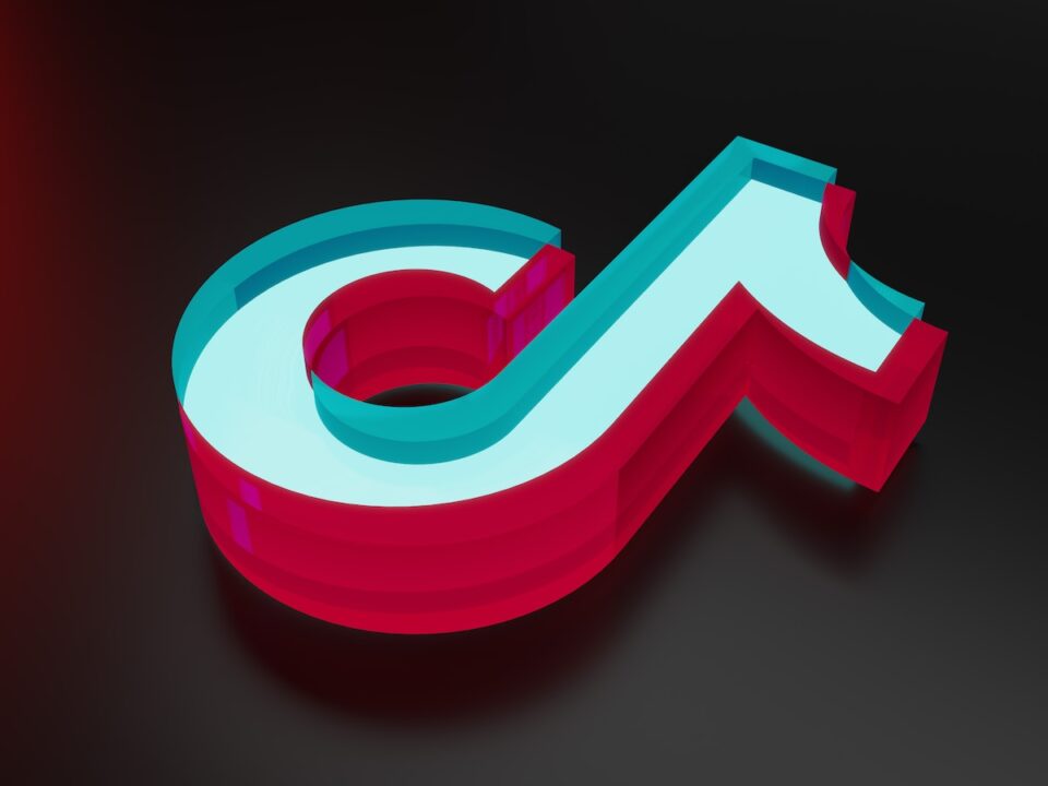 a red, white and blue letter on a black background